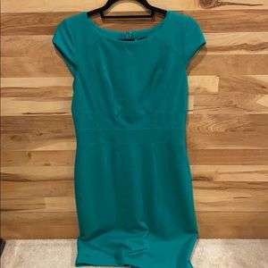 Beautifully lined Emerald green dress